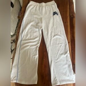 White retro sweatpants with a light blue strip down both pant legs